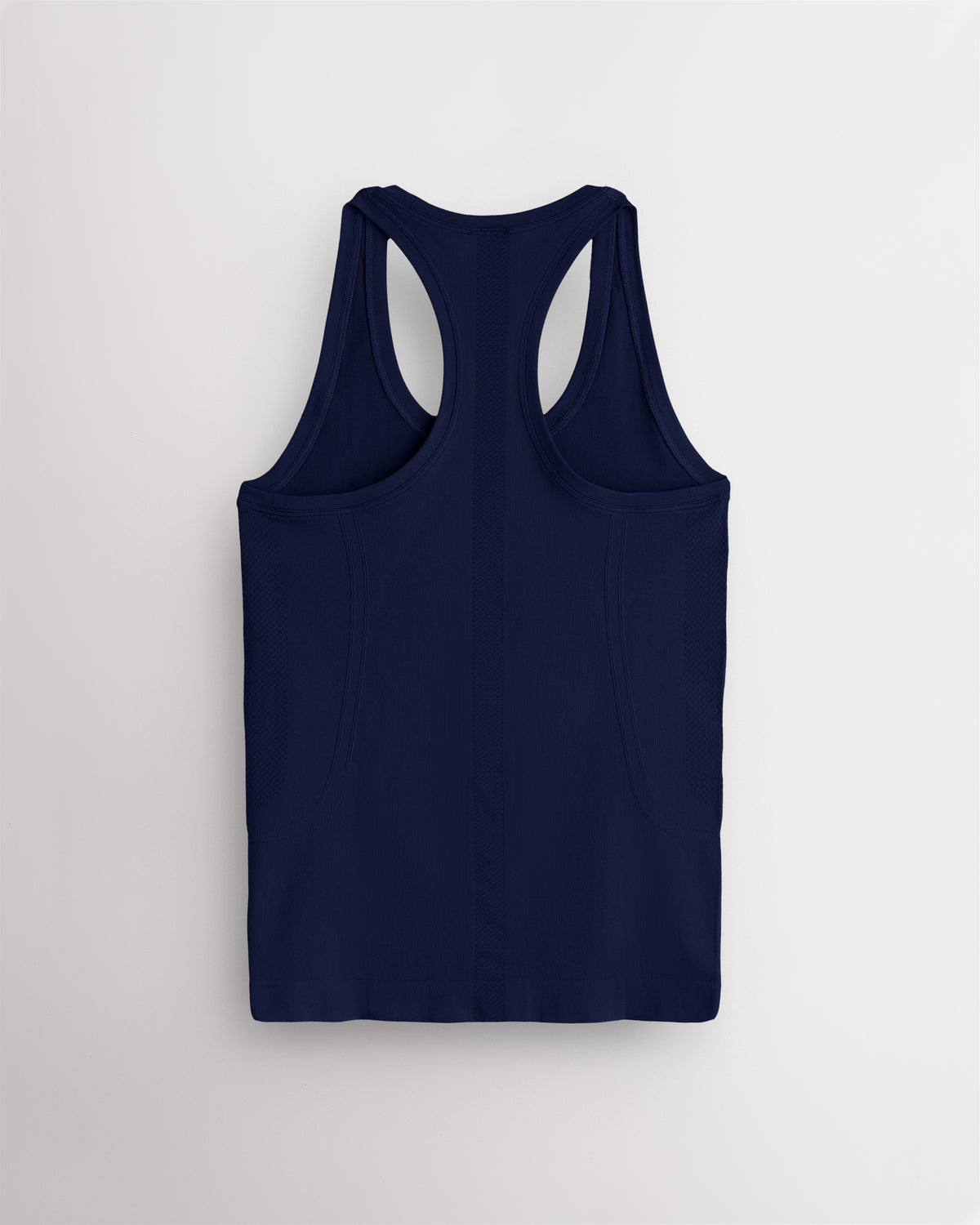 Back view of the navy Stelle seamless tank top, laid flat to show the racerback straps.