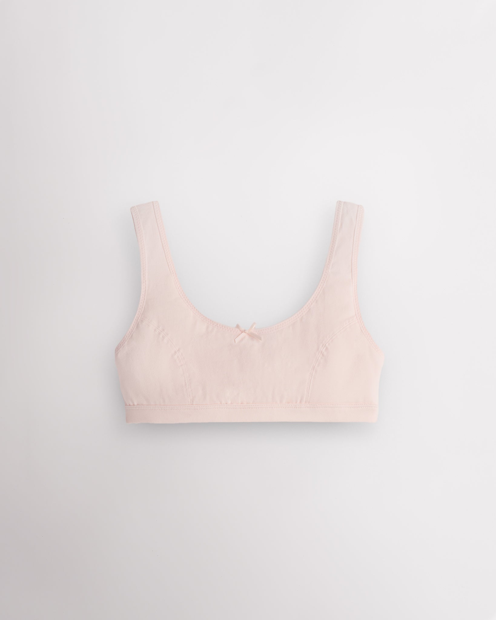 Stelle girls cotton bralette in whisper pink with wide straps, cotton padding, and easy layering design