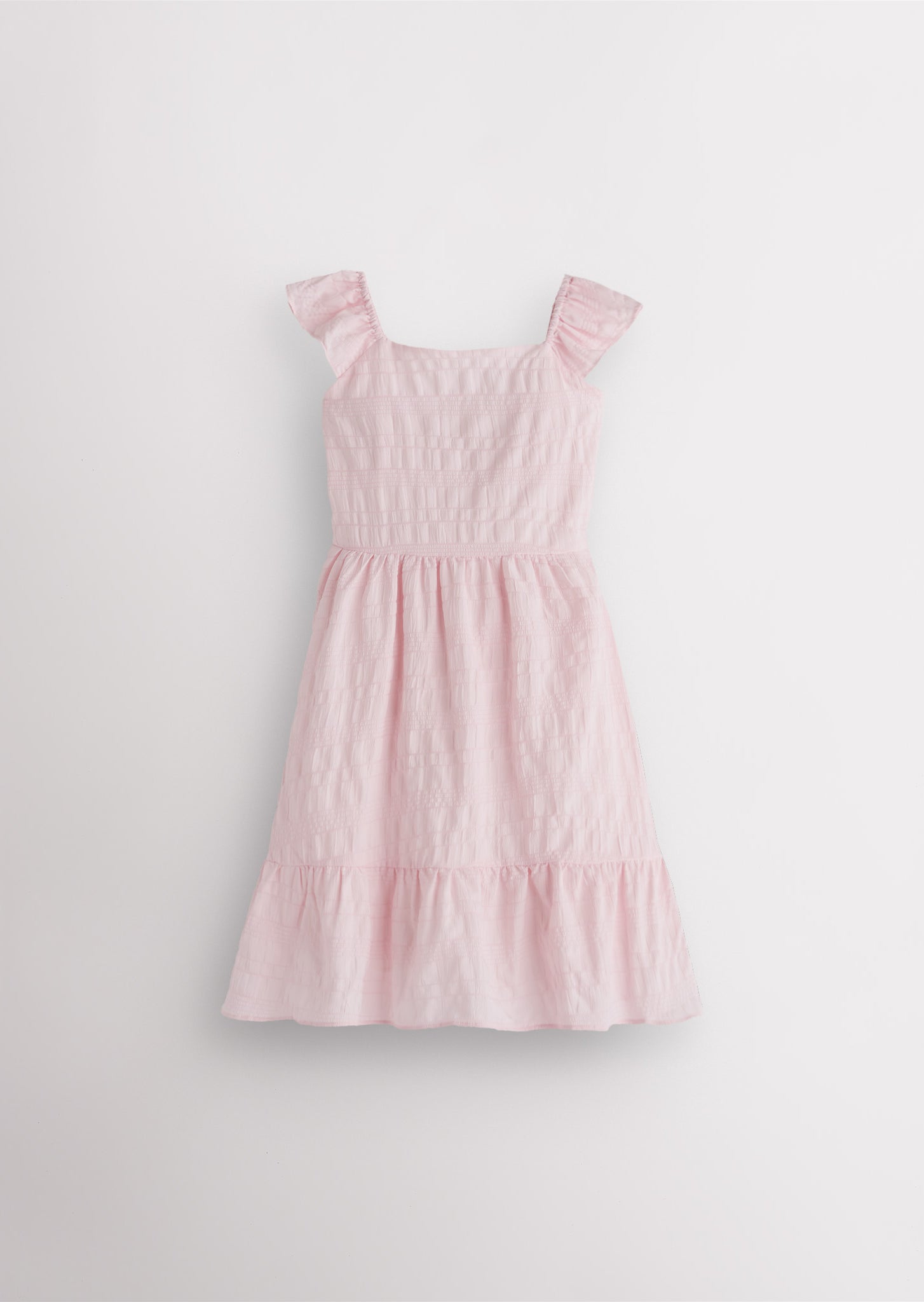 Girls light pink flutter sleeve sundress with square neckline, smocked waist, and tiered hem, lightweight summer dress front view