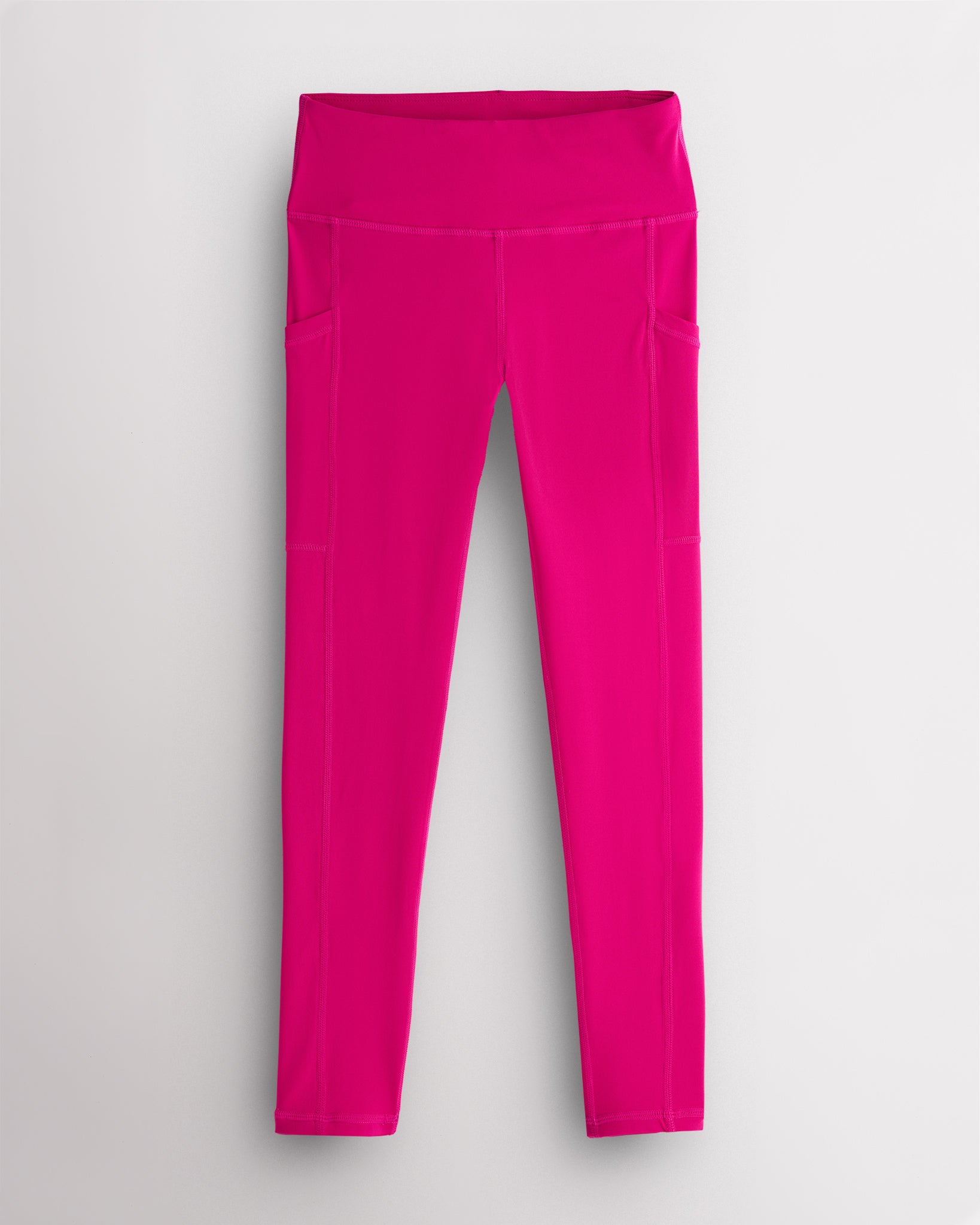 Hot pink girls athletic leggings with high-waisted fit and deep side pockets, comfortable workout leggings for girls