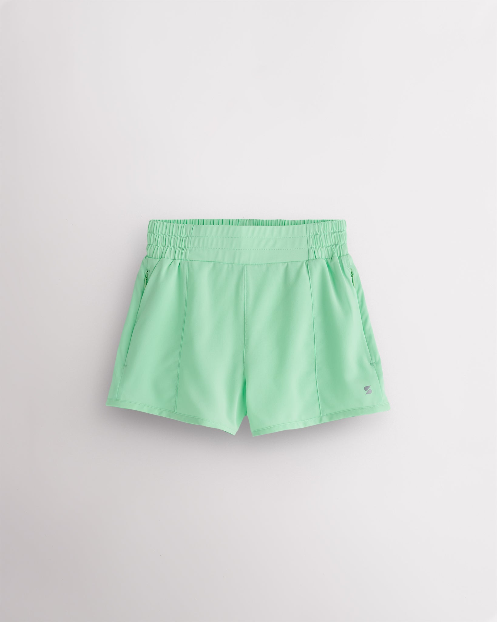 Neon green kids shorts with high waist elastic waistband and lightweight breathable fabric for active wear