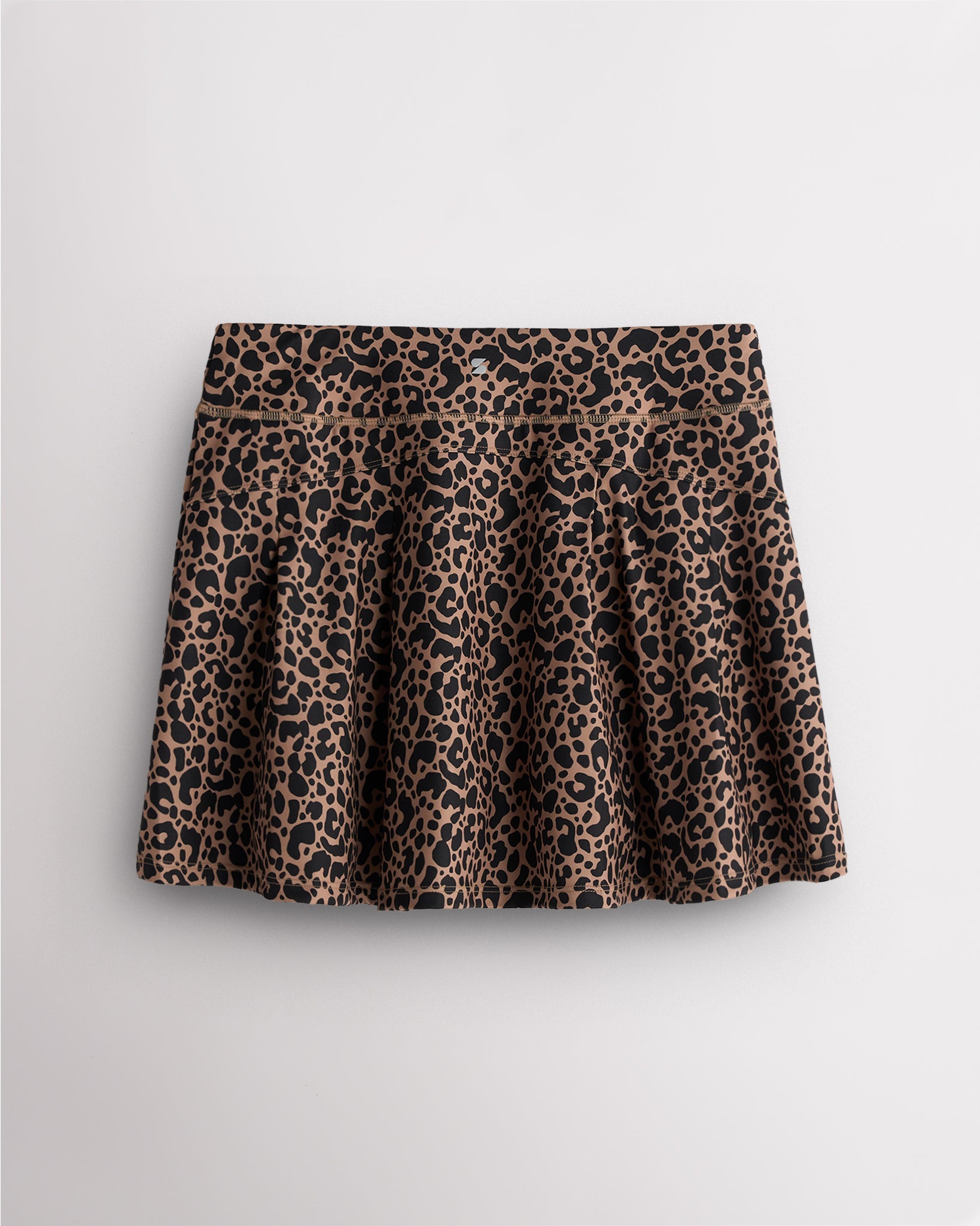 Back view of pleated tennis skirt in leopard print showing flared silhouette