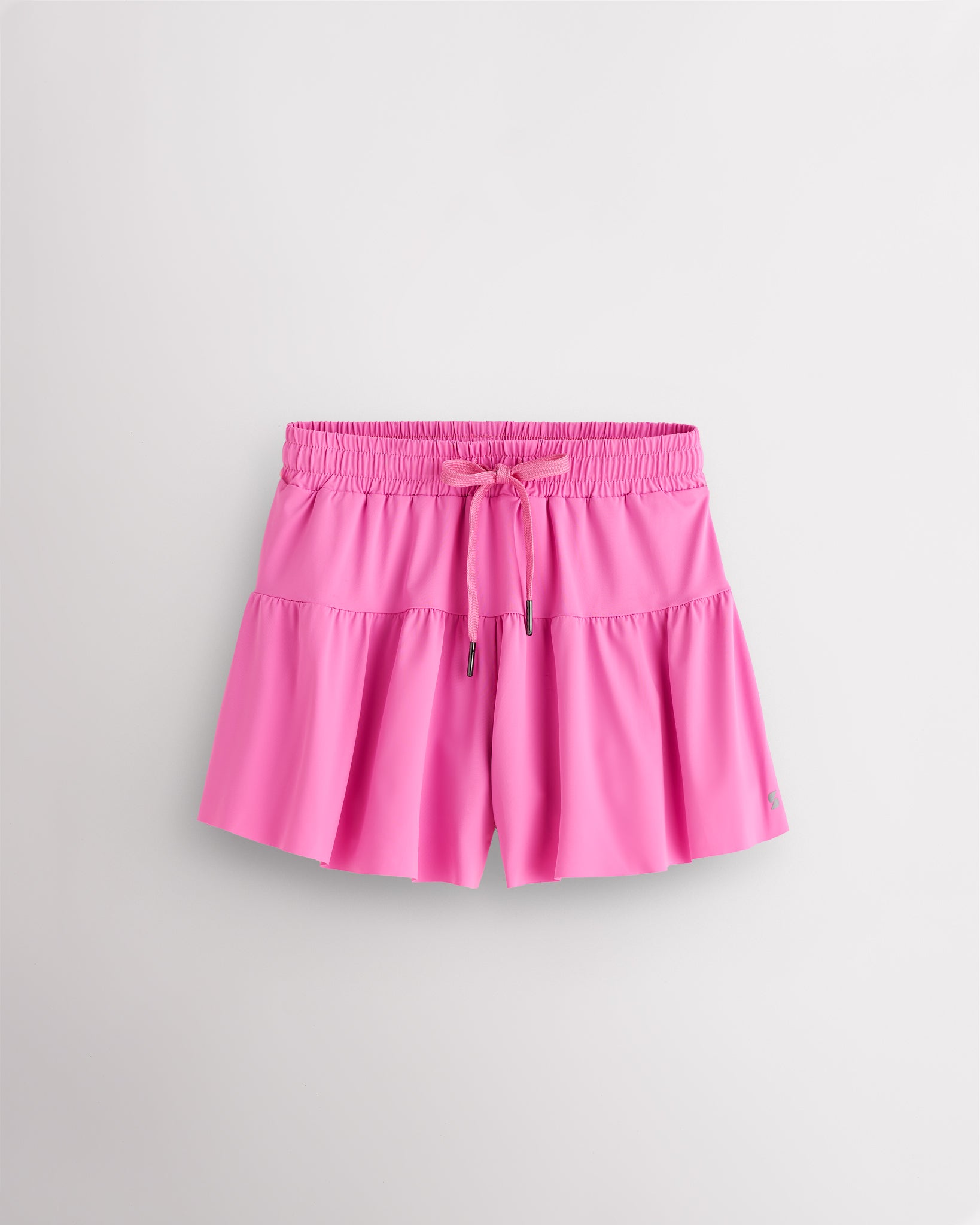 Cotton Candy Kids Let’s Bounce Shorts with flowy design, elastic waistband, drawstring, lightweight fabric, and built-in lining for practice and play.