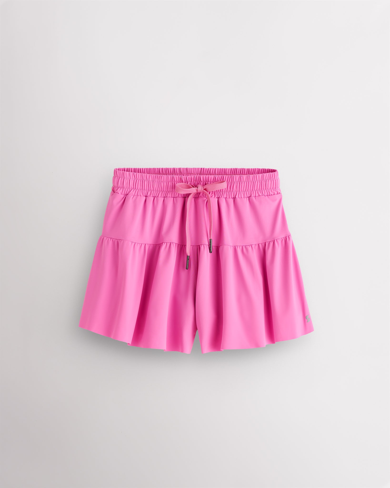 Cotton Candy Kids Let’s Bounce Shorts with flowy design, elastic waistband, drawstring, lightweight fabric, and built-in lining for practice and play.