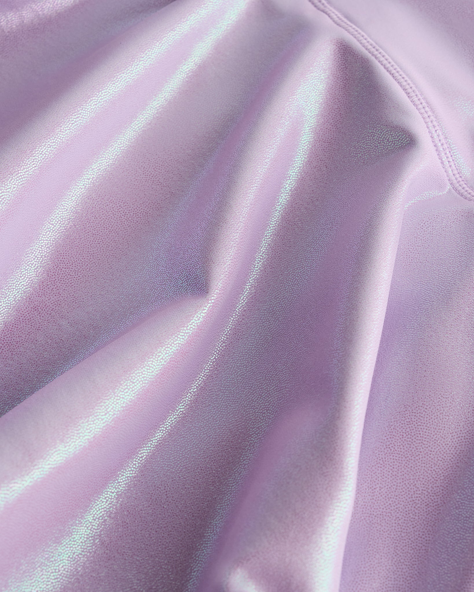 Close-up of lavender Stelle girls shimmer skort showing iridescent fabric texture and smooth seam detail