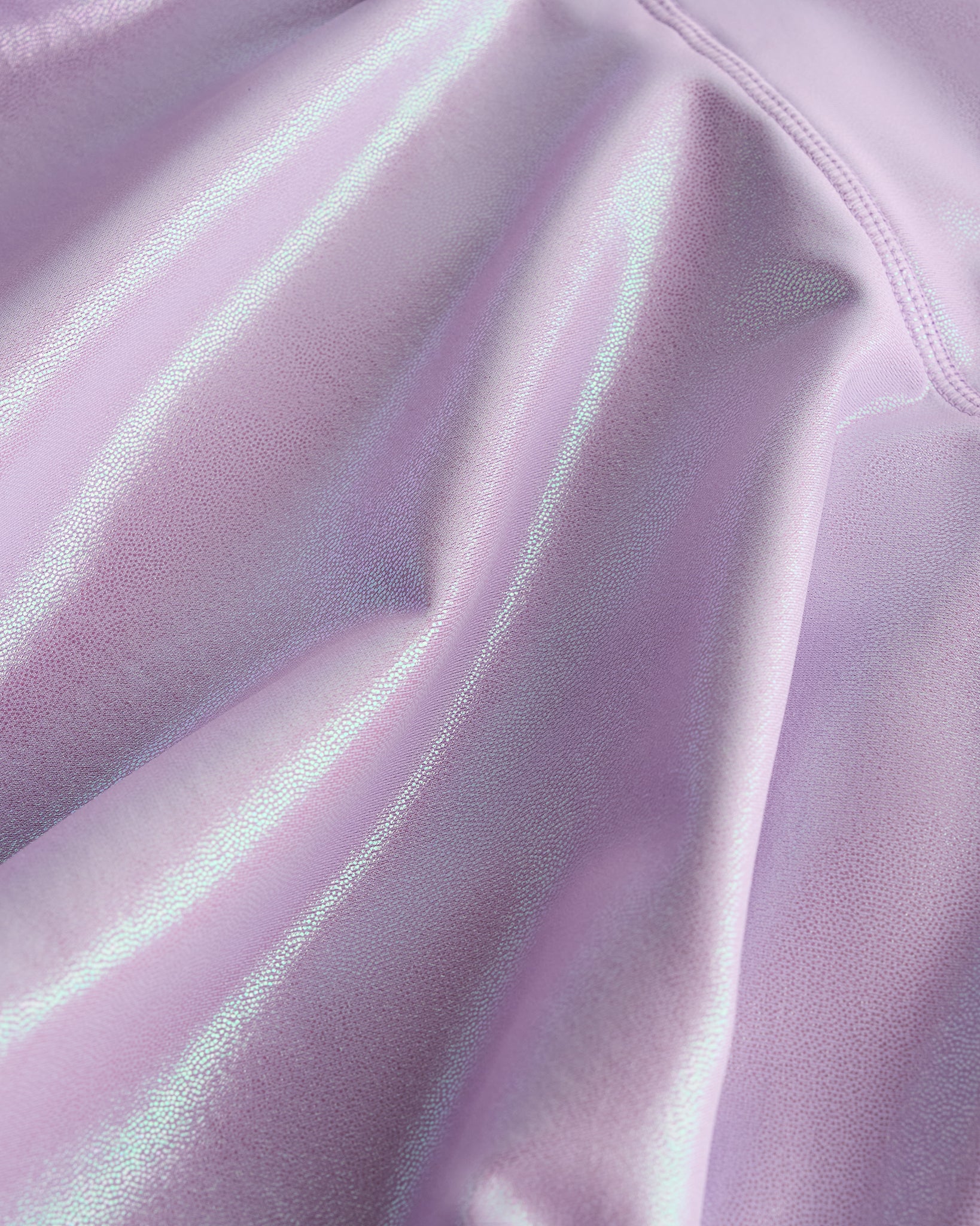 Close-up of lavender Stelle girls shimmer skort showing iridescent fabric texture and smooth seam detail