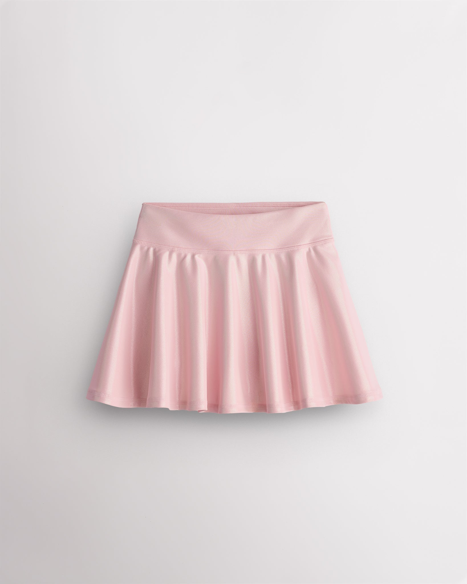Pink Stelle girls shimmer skort with high-waisted fit and flared skirt design on white background