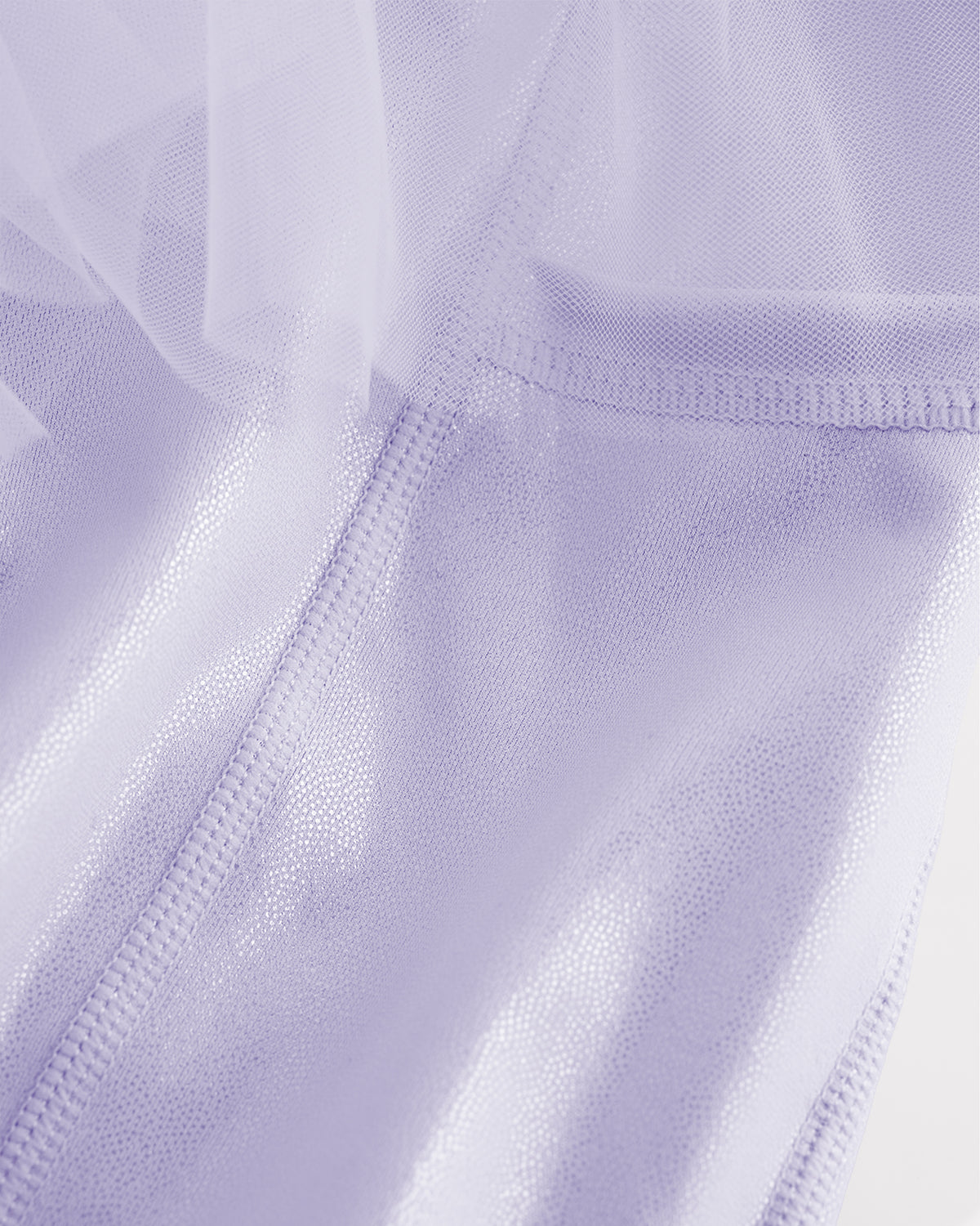 Close-up of lavender skort for girls showing sheer tiered mesh and shiny built-in shorts.