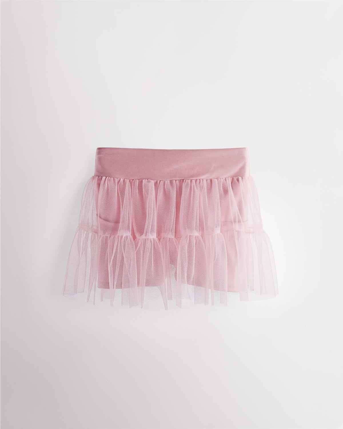 Pink girls layered skort with a high-waisted fit, tiered mesh skirt, and built-in shimmer shorts.