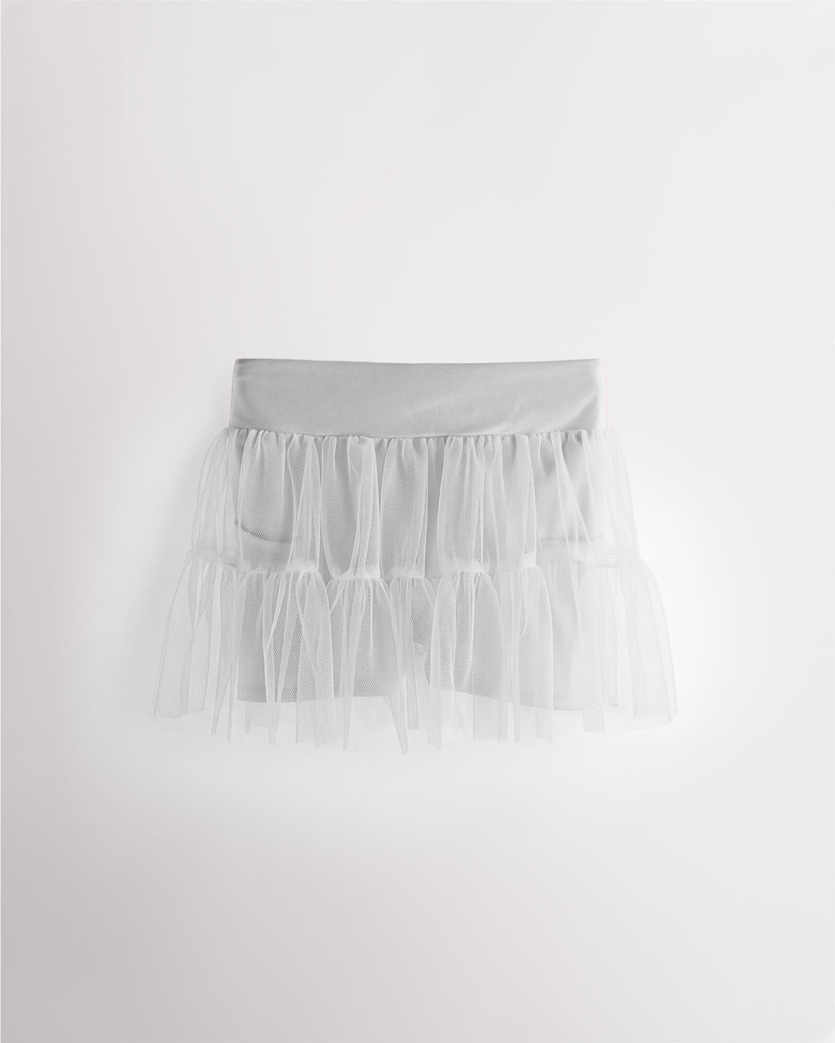 White girls layered skort with a high-waisted fit, tiered mesh skirt, and built-in shimmer shorts.