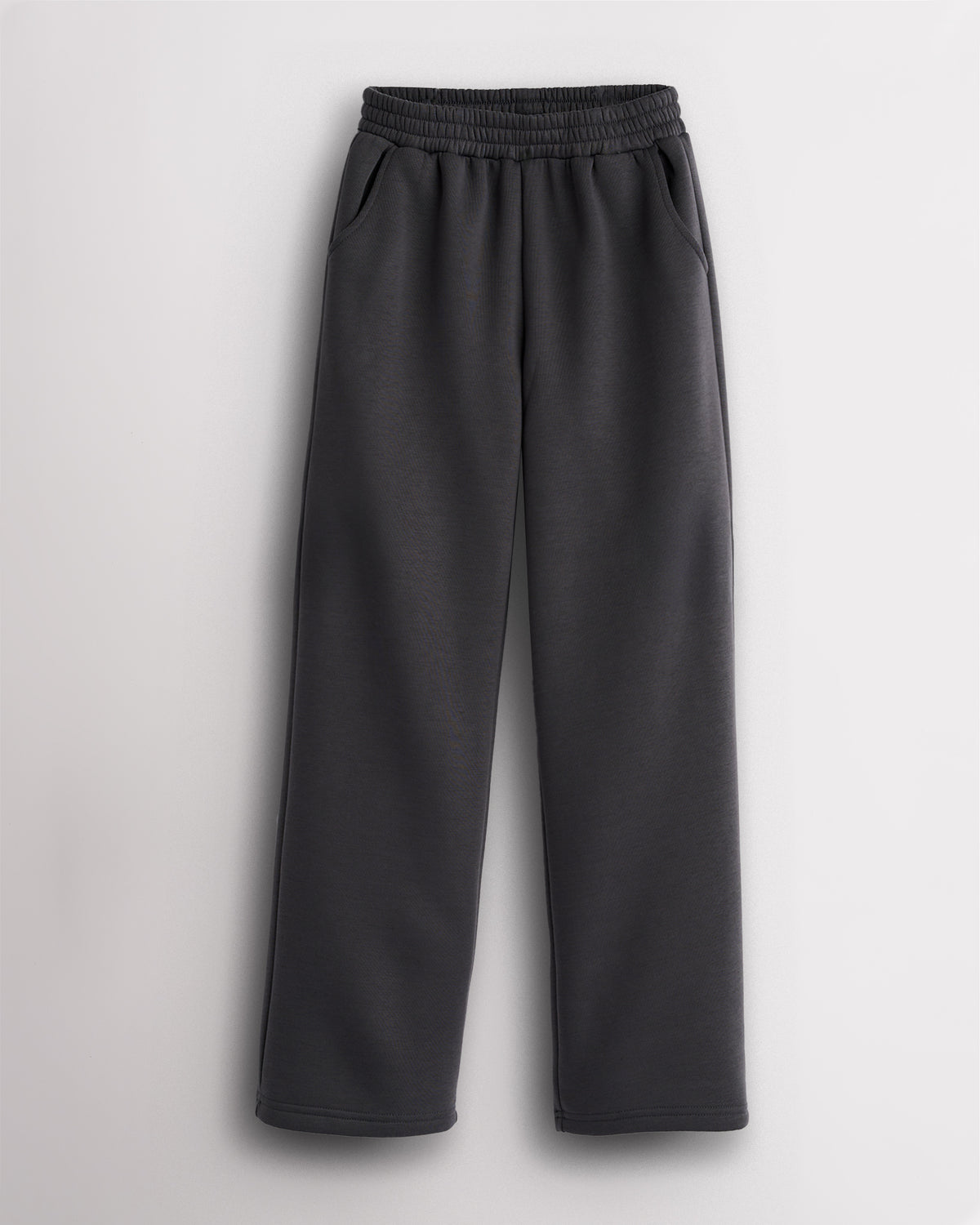 Charcoal kids fleece sweatpants with elastic waistband, roomy side pockets, straight-leg fit, and soft fleece lining for school, practice, and everyday wear.