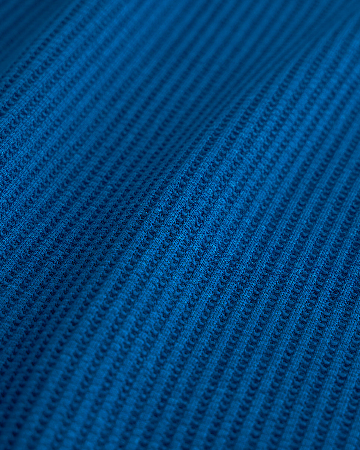 Close-up of the navy waffle knit texture on the Stelle kids lounge set.