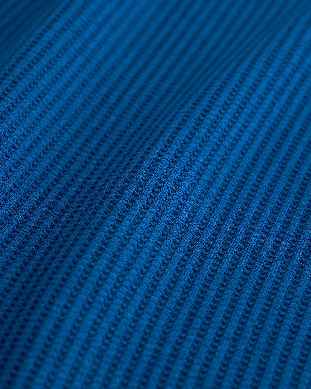 Close-up of the navy waffle knit texture on the Stelle kids lounge set.