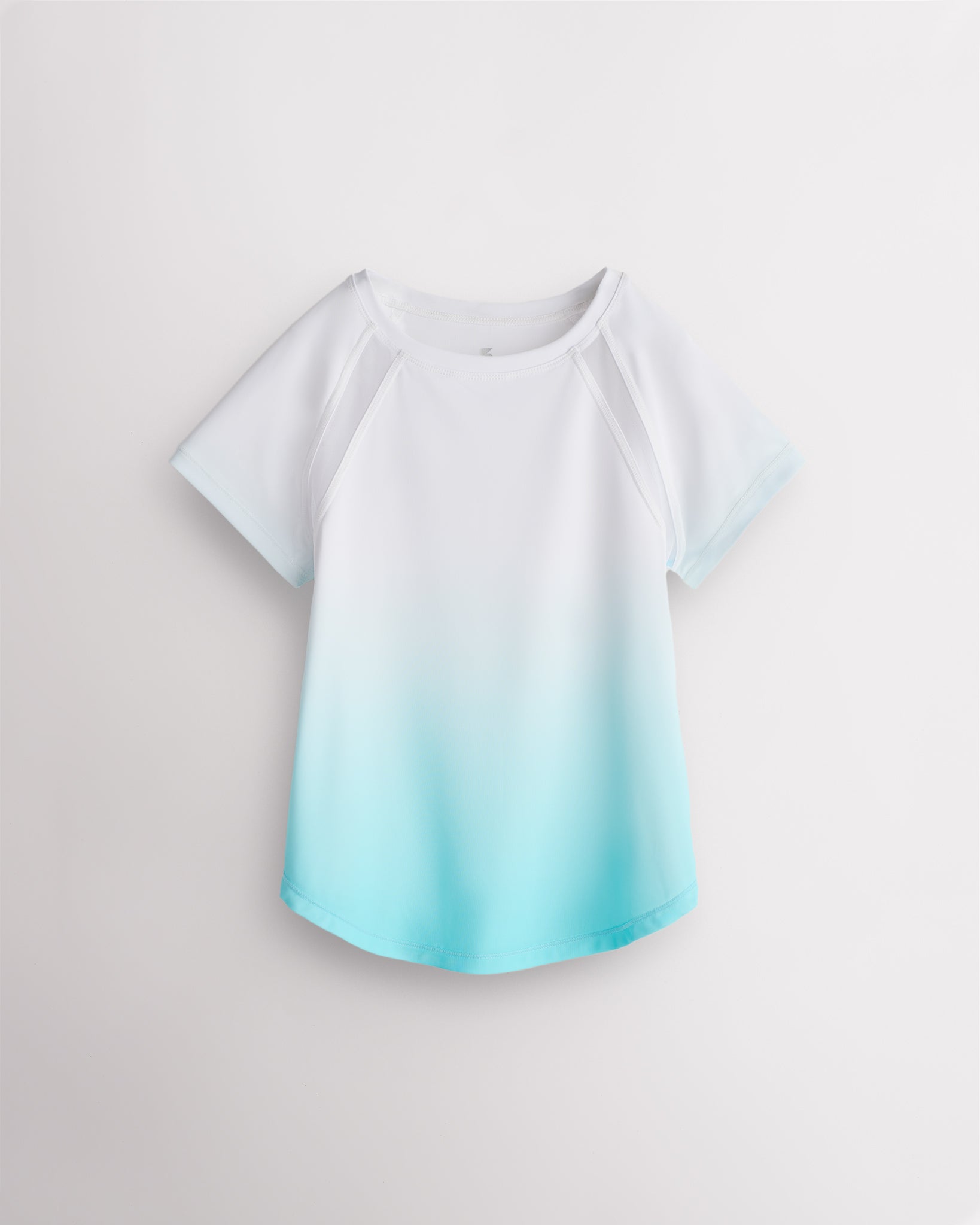 Stelle kids ombre athletic t-shirt with mesh paneling, raglan sleeves, and curved hem on white background