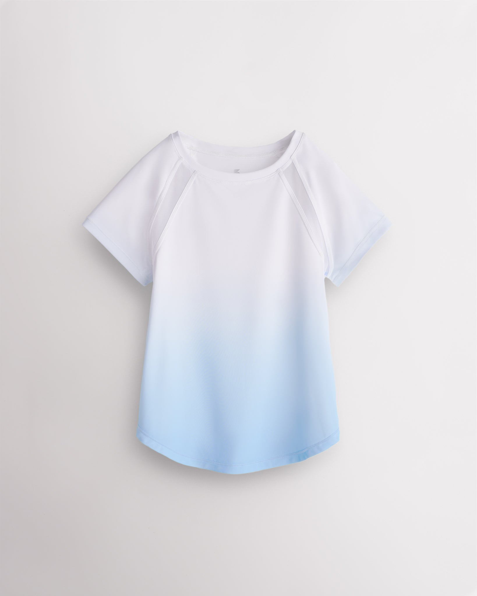 Stelle kids ombre athletic t-shirt with mesh paneling, raglan sleeves, and curved hem on white background