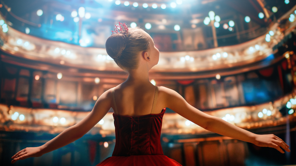 girl in a red tutu dancing on the stage