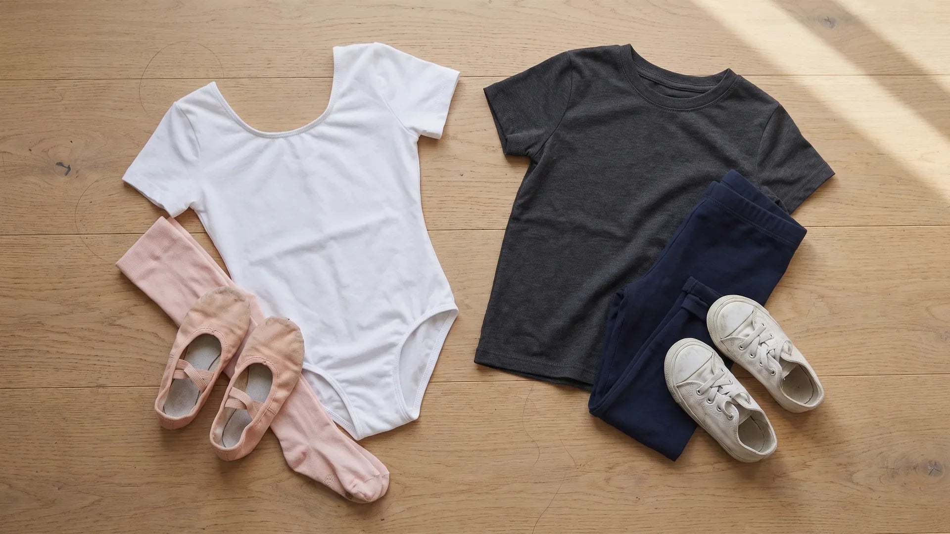 Two girls' dance outfits laid out flat side by side: ballet leotard set and hip hop set