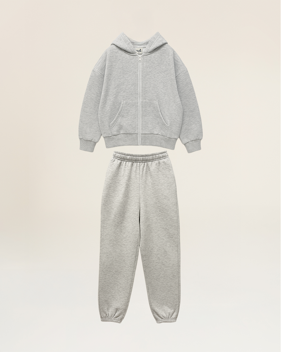 Gray hoodie and jogger pants set on a beige background