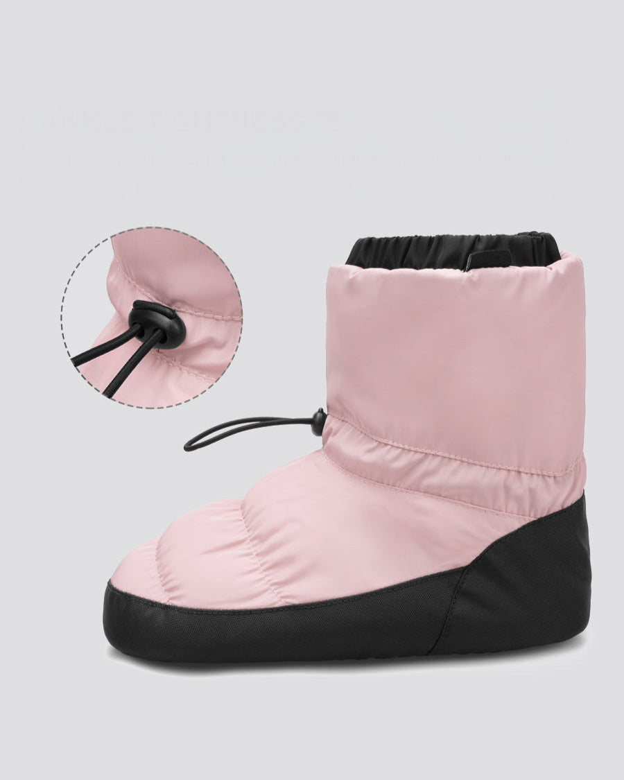 Pink and black baby booties with a close-up of the drawstring on a light gray background.