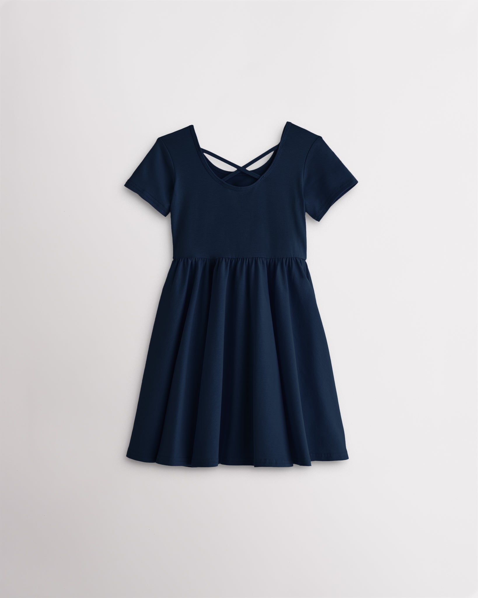 Girls navy short sleeve A-line twirly dress with a flared skirt.