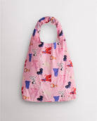Puppy Parade on Pink Stelle reusable grocery bag with colorful puppy print, designed as reusable shopping bags for groceries and daily errands.