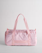 Pink gingham duffle bag with multiple pockets and sturdy straps for organized storage.