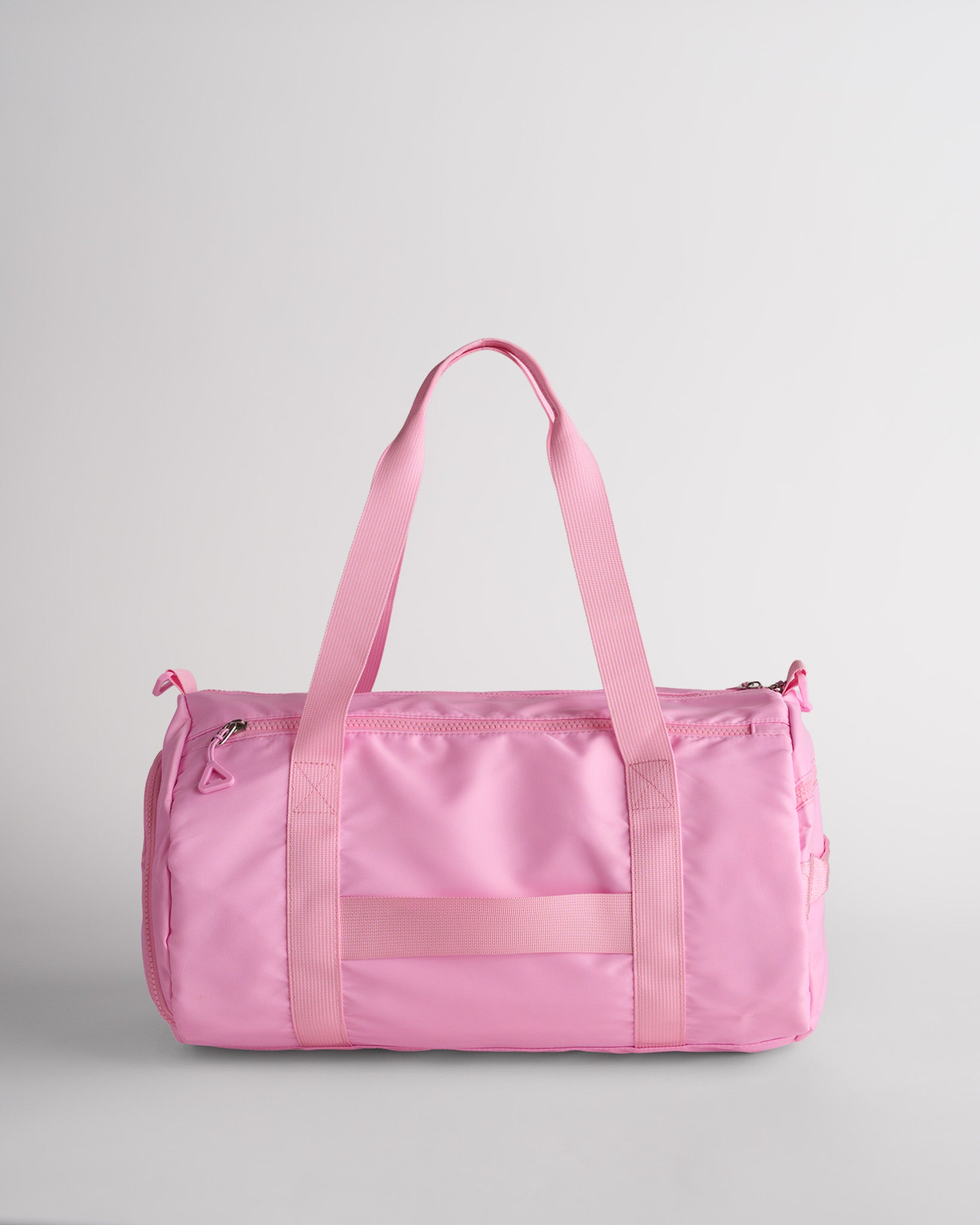 Taffy Pink duffle bag with multiple pockets and sturdy straps for organized storage.