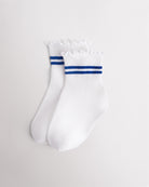 White kids socks with blue sporty stripes, ribbed cuffs, and lettuce-edge ruffle trim