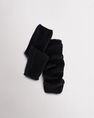 Black knit kids ballet leg warmers laid flat with a fitted shape and ribbed texture.