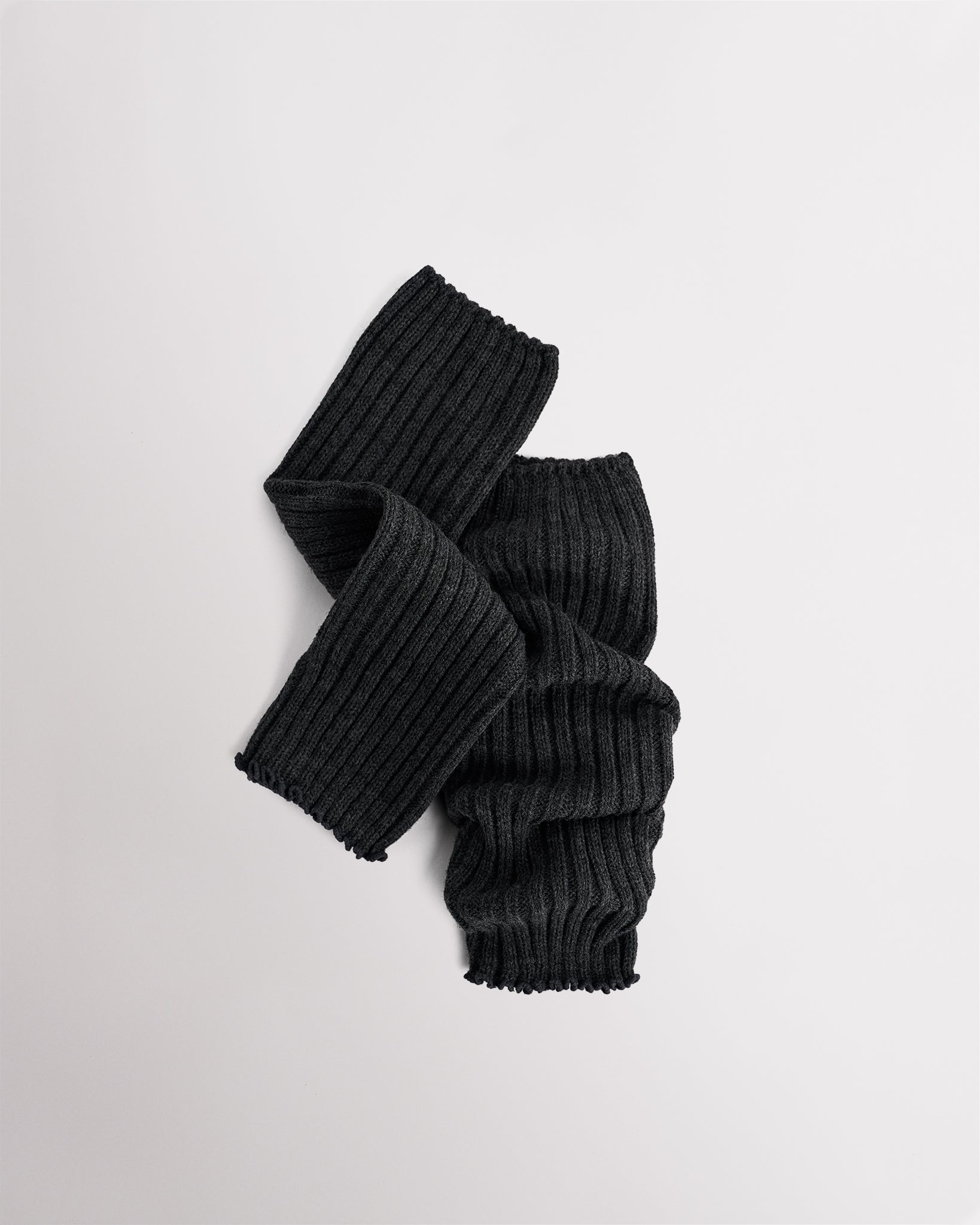 Heather Charcoal knit kids ballet leg warmers laid flat with a fitted shape and ribbed texture.