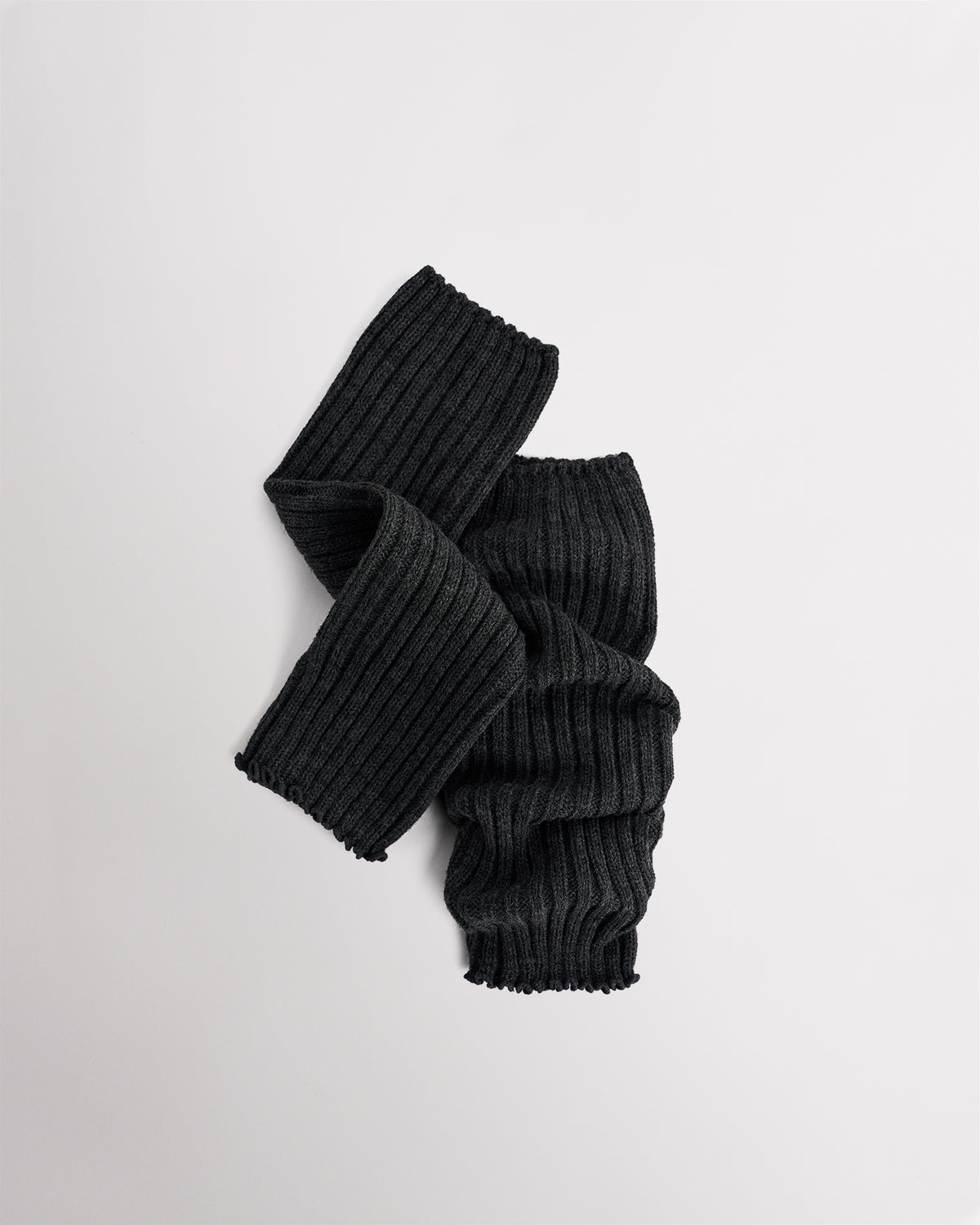 Heather Charcoal knit kids ballet leg warmers laid flat with a fitted shape and ribbed texture.