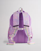 Back view of lavender Stelle kids backpack with padded shoulder straps, buckle chest strap, mesh back panel, and rainbow handles.