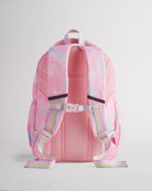 Back view of pink Stelle kids backpack with padded shoulder straps, buckle chest strap, mesh back panel, and rainbow handles.