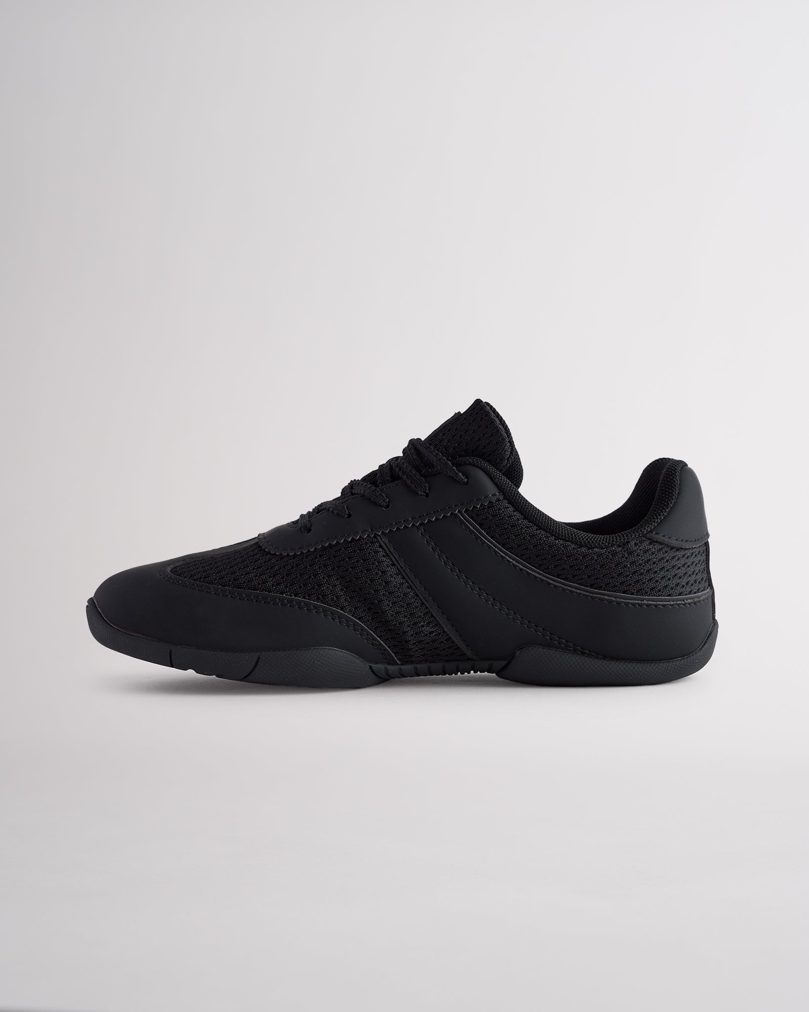 Black Studio air mesh cheer shoes with lace-up closure.