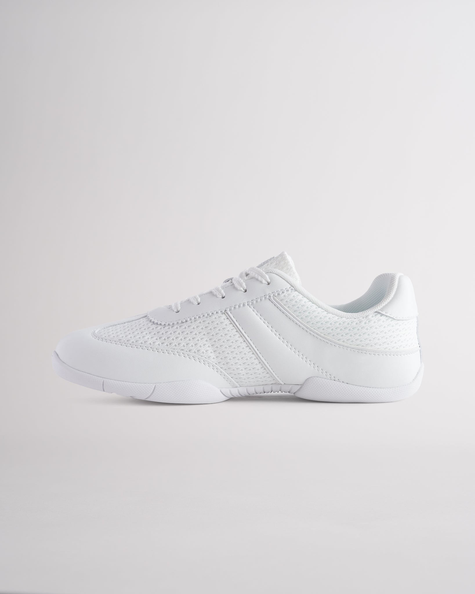 White Studio air mesh cheer shoes with lace-up closure.