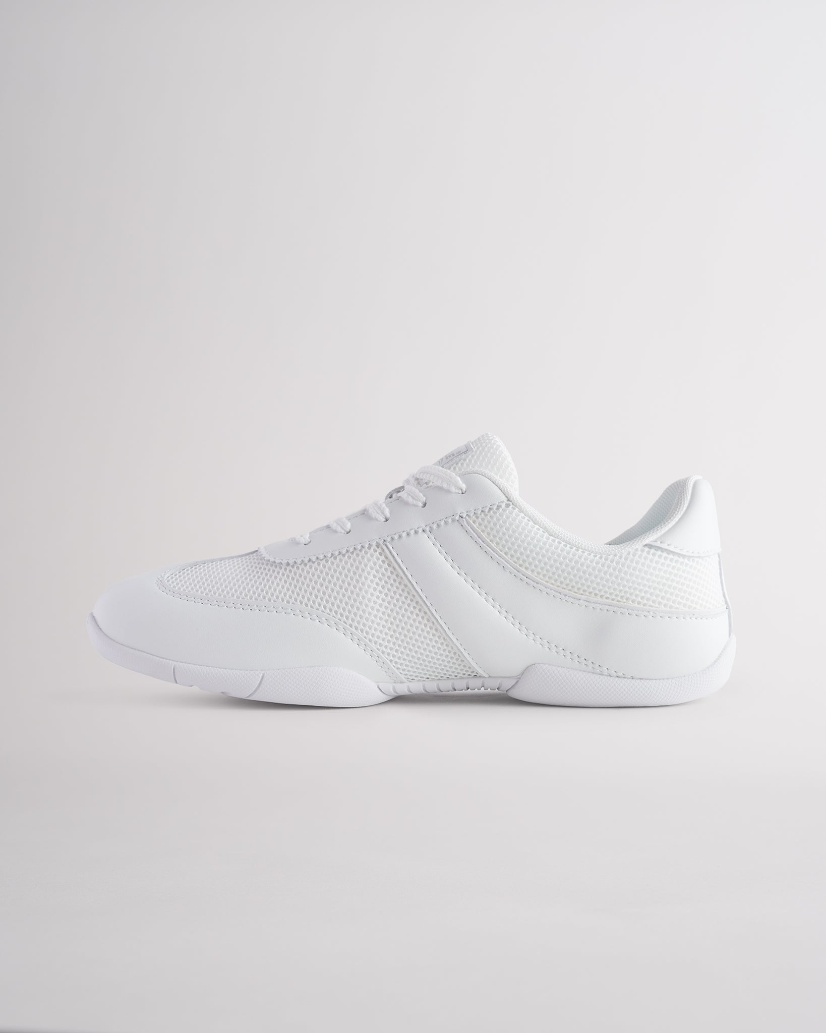 White Studio fine mesh cheer shoes with lace-up closure.