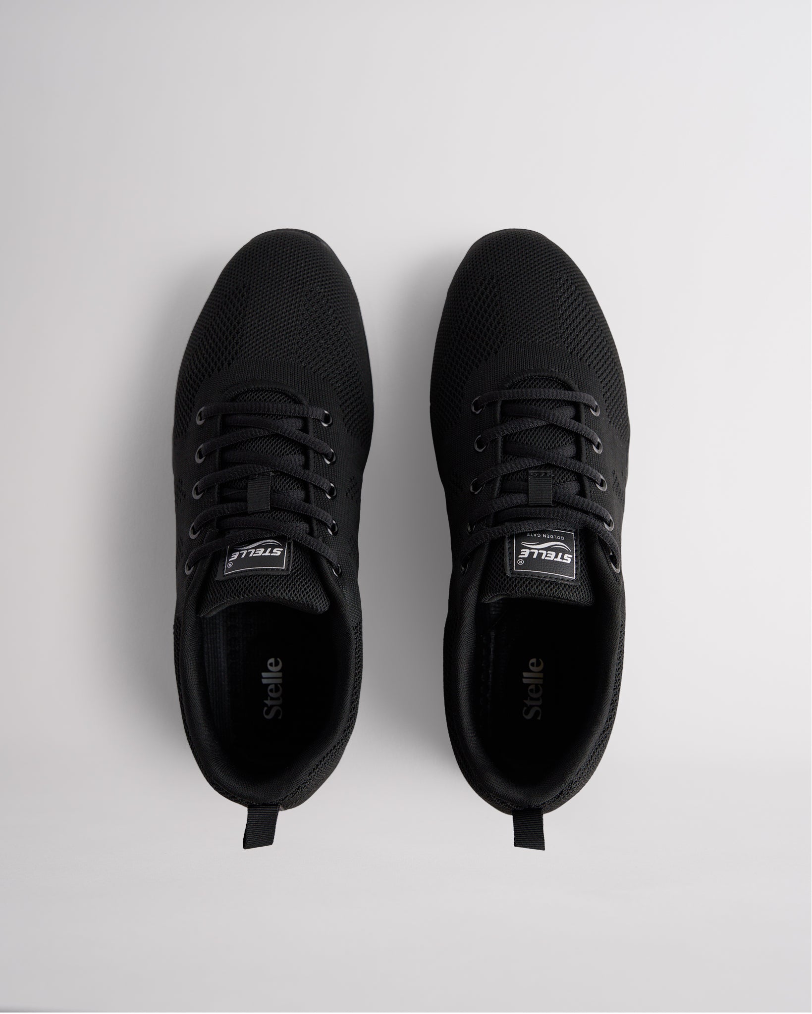 Top view of black womens cheer shoes with lace-up closure and cushioned interior