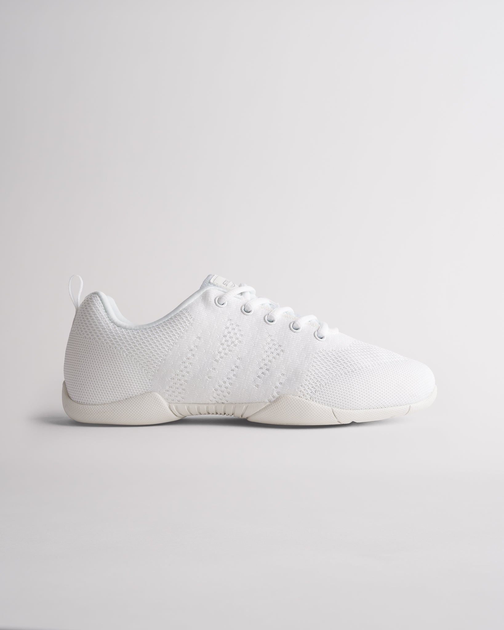 White womens cheer shoes with breathable knit upper and flexible sole for training