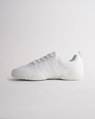 White cheerleading shoes with lace-up design and adaptive knit upper for secure fit