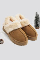 Platform slippers with classic brown suede uppers.