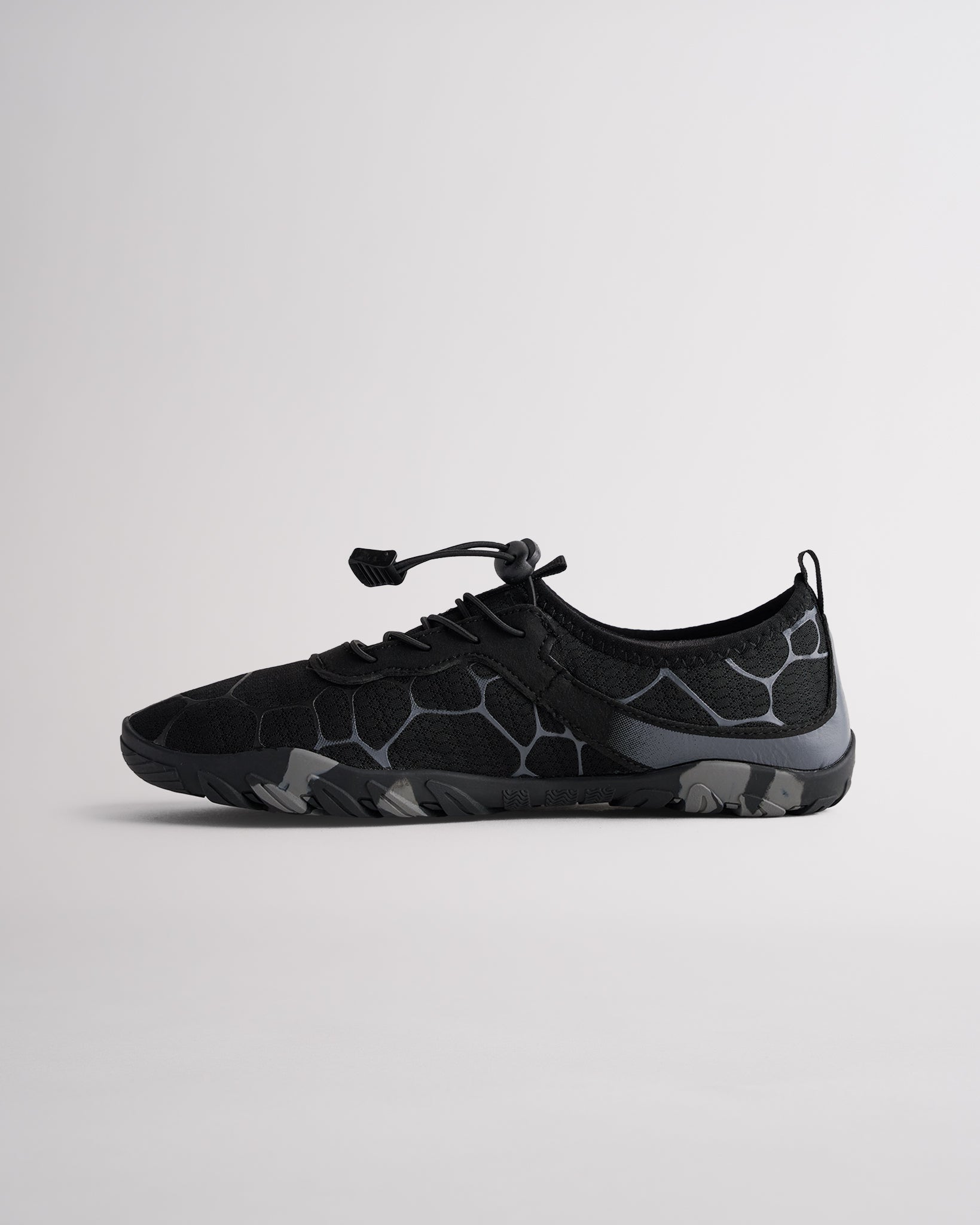 Angled view of black womens water shoes showing breathable mesh and flexible sole