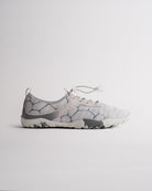 Chalk women’s water shoes with mesh upper and speed lace system, side profile view
