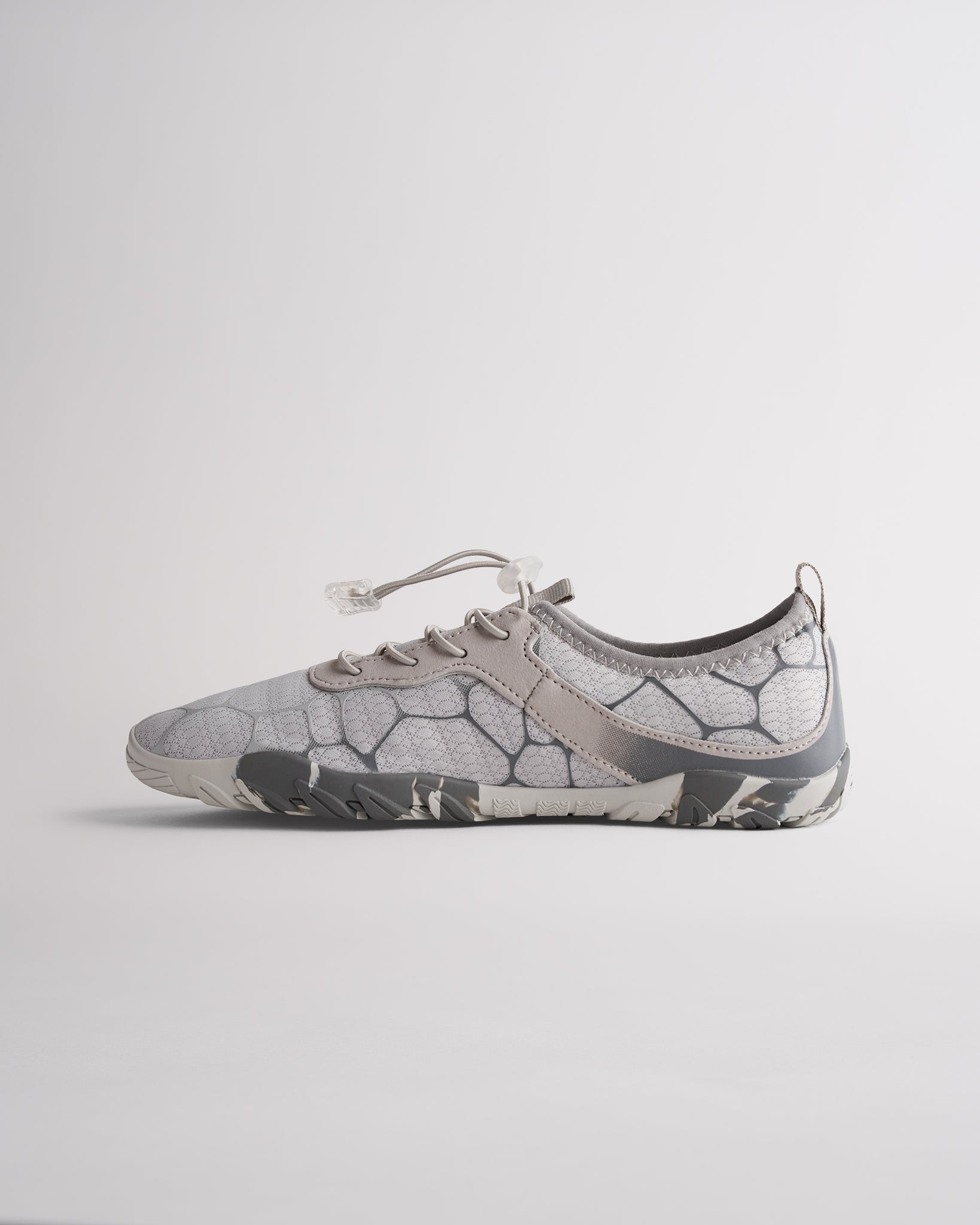 Angled view of chalk womens water shoes showing breathable mesh and flexible sole