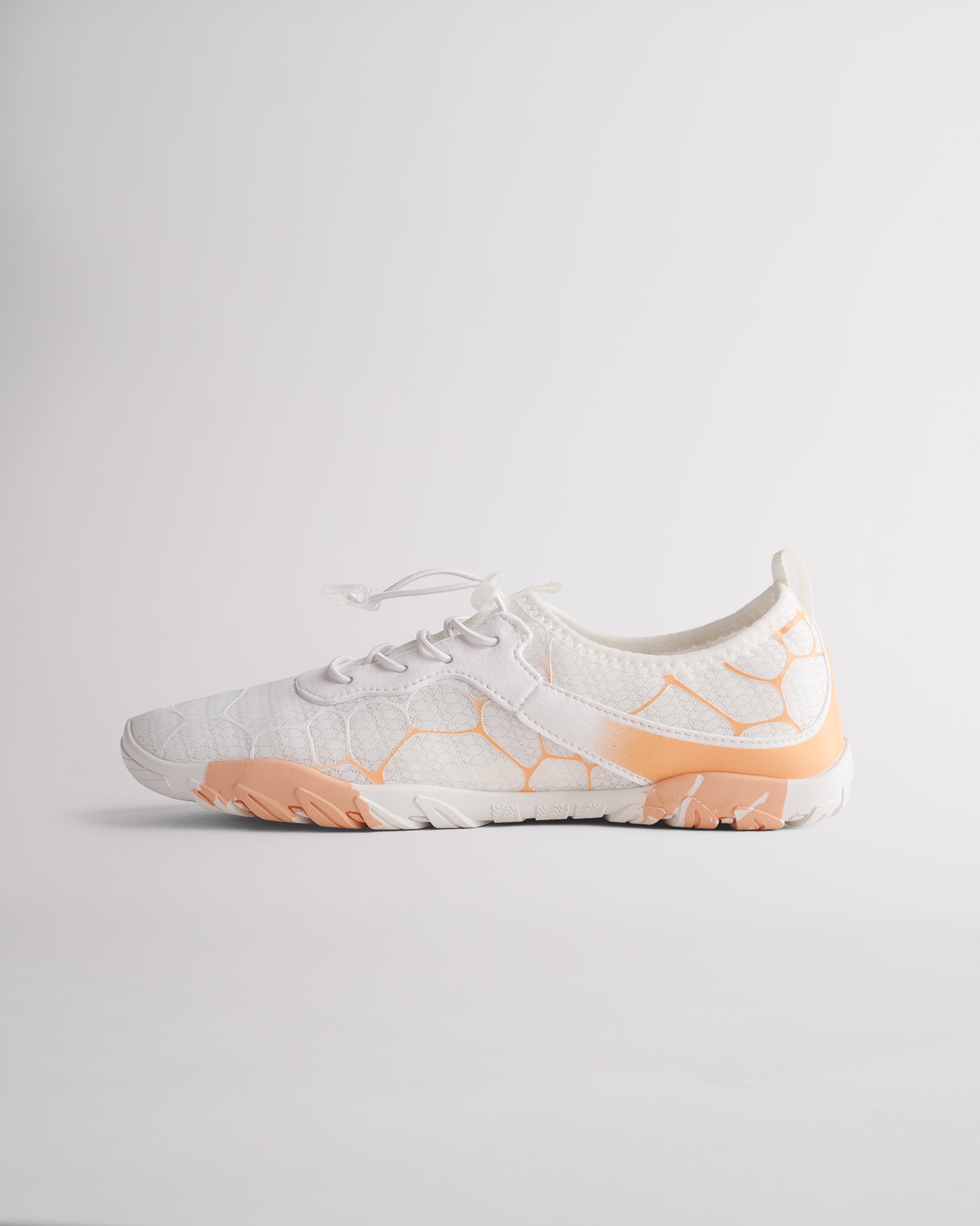 Angled view of white womens water shoes showing breathable mesh and flexible sole