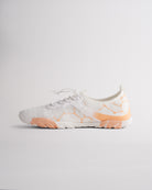 Angled view of white womens water shoes showing breathable mesh and flexible sole