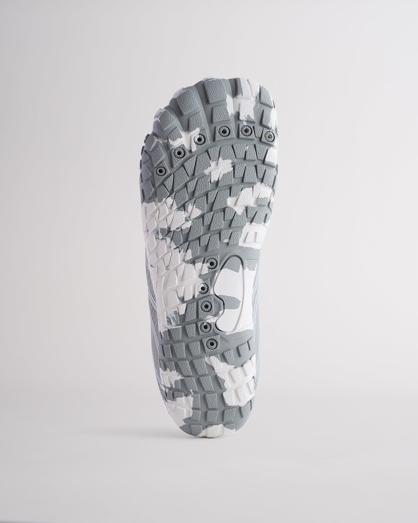 Bottom view of water shoes with textured traction outsole and drainage holes