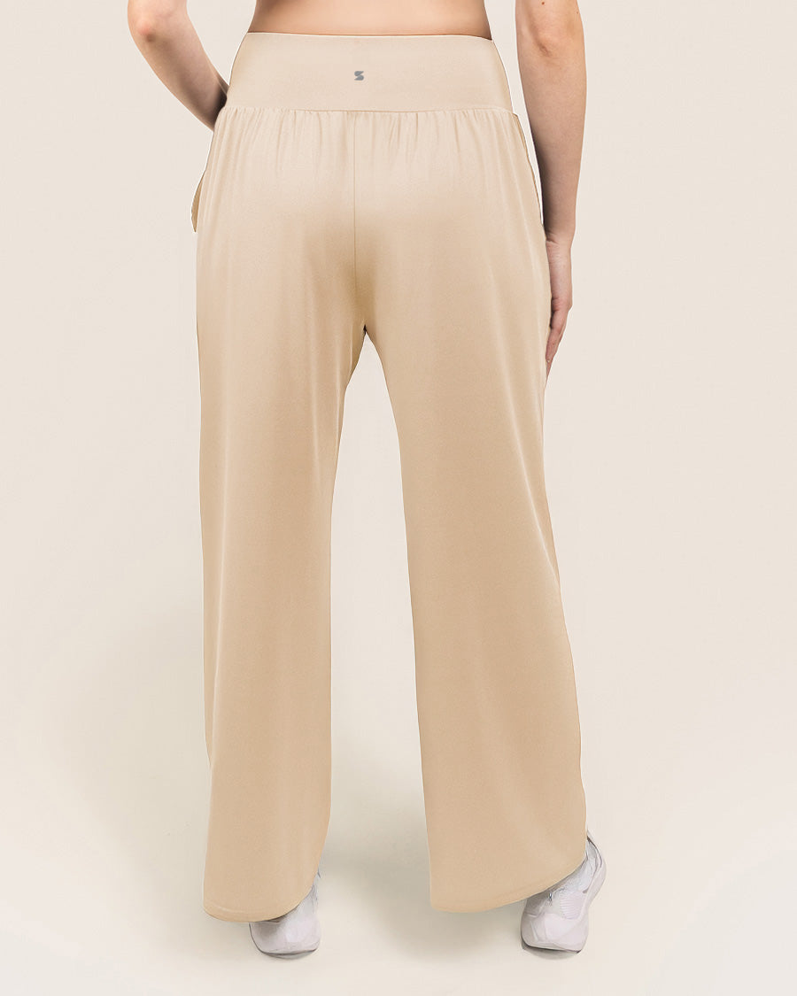 Beige wide-leg pants worn by a person on a plain background