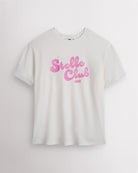 White Stelle oversized T-shirt with a pink Stelle Club graphic, laid flat on a grey background.
