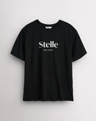 Black Stelle oversized T-shirt with a white Stelle logo on the chest, laid flat on a grey background.