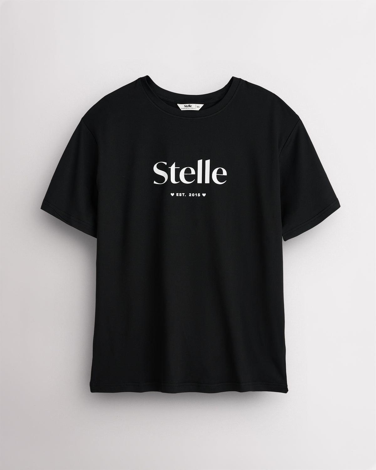 Black Stelle oversized T-shirt with a white Stelle logo on the chest, laid flat on a grey background.